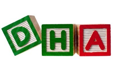 Wooden blocks forming the letters DHA isolated on white background